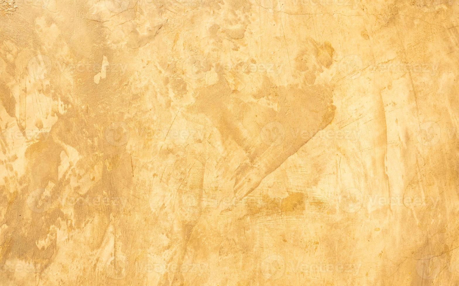 Abstract Grunge dekorative goldene Stuckwand mit Kratzern, Schrammen Hintergrund. kunststilisiertes texturbanner mit kopierraum. foto