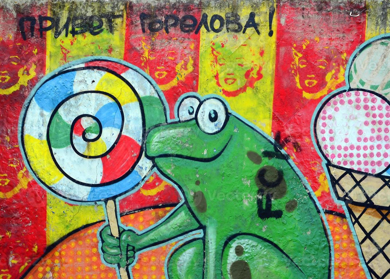 Straßenkunst. abstraktes Hintergrundbild eines vollständig abgeschlossenen Graffiti-Gemäldes mit Cartoon-Frosch und Lutscher foto