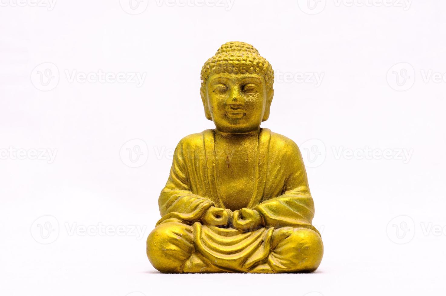 Buddha-Miniatur auf weißem Hintergrund foto