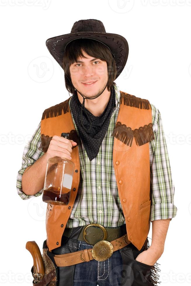 junger Cowboy mit einer Flasche foto