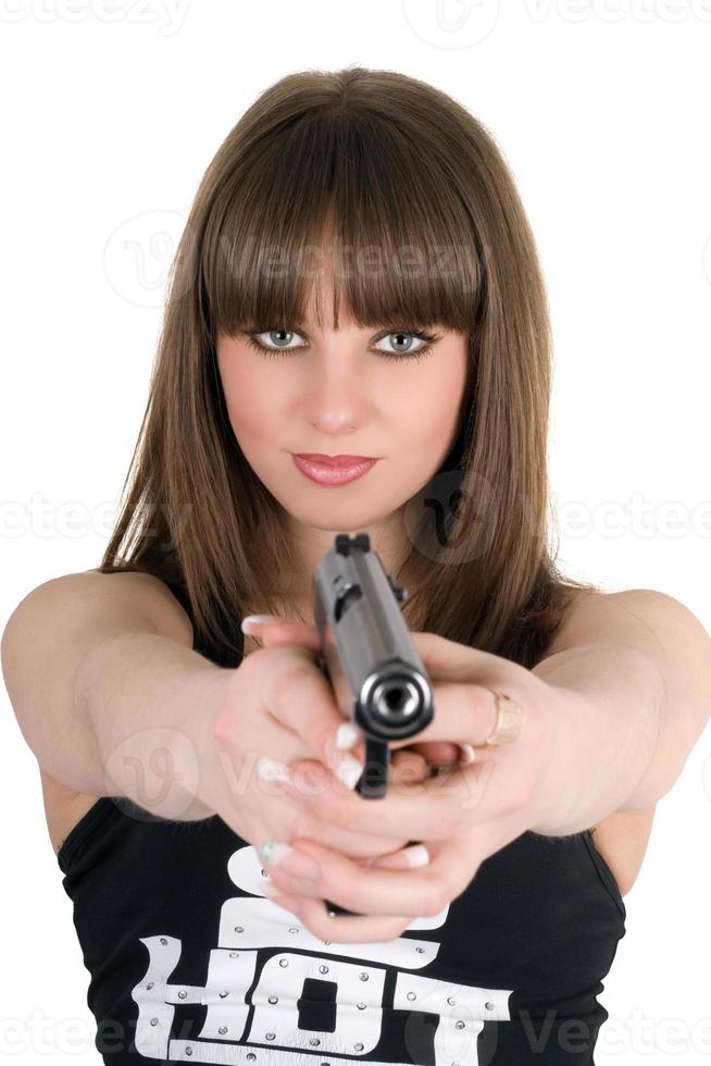 hübsches Mädchen in einer Weste mit Pistole foto