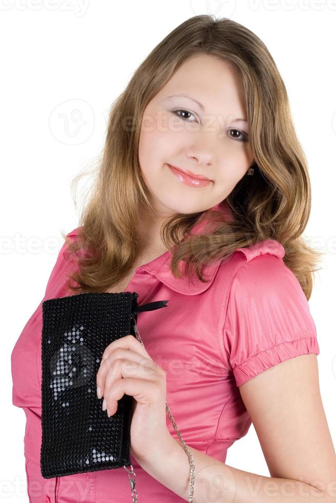 schöne junge Frau mit einer Handtasche. isoliert foto