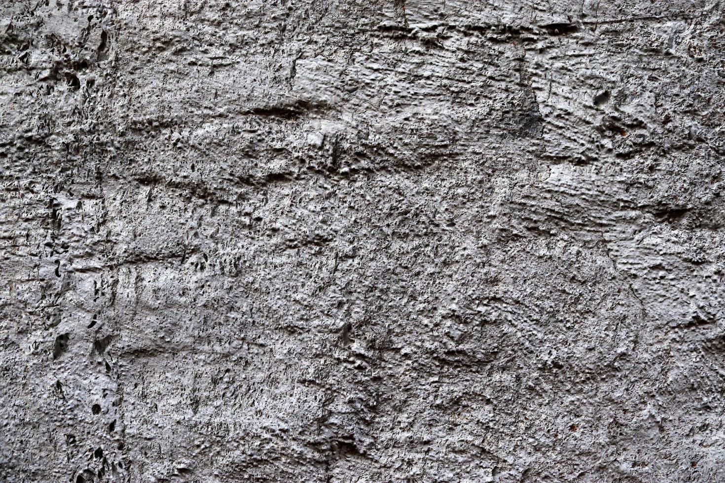 Nahaufnahme einer Granit- und Steinwandstruktur in hoher Auflösung. foto