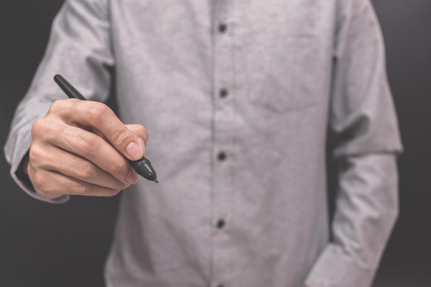 Geschäftsmann mit einem Stift foto