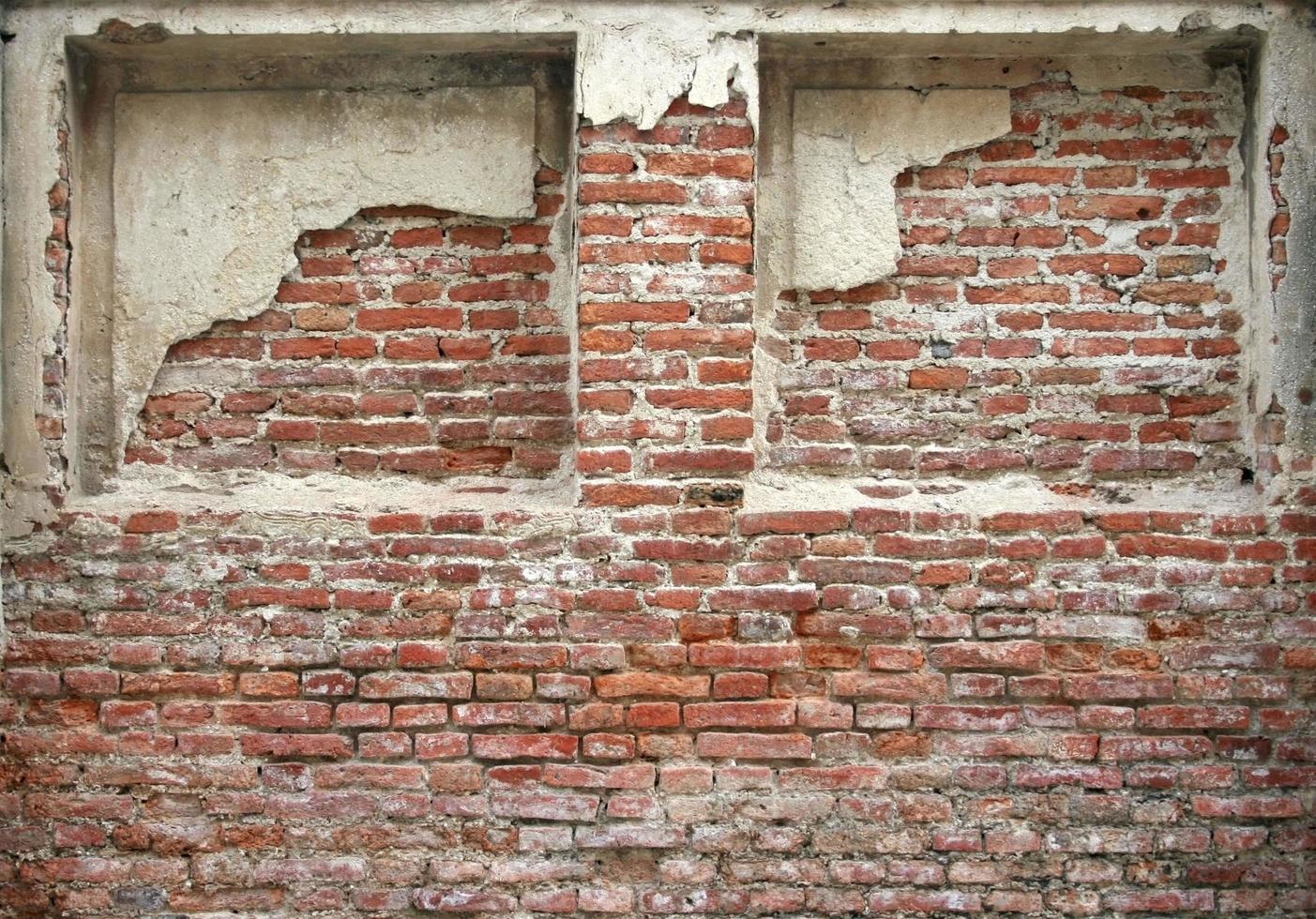 Abgenutztes Backsteingebäude foto