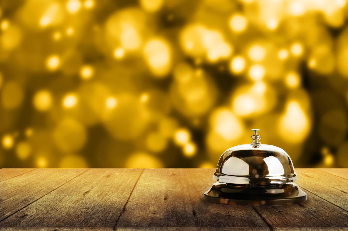 Service Glocke und Gold Bokeh foto