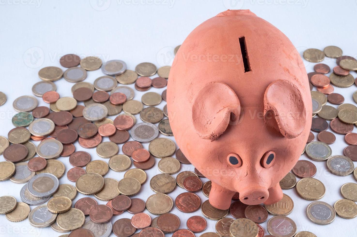 Sparschwein auf Münzen foto