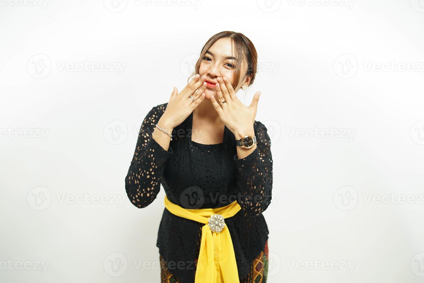 balinesisch Frau drückt aus ihr Schock mit ein Hand Über ihr Mund, foto