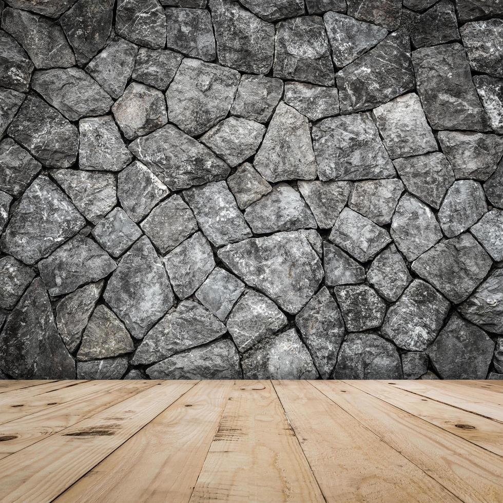 Stein Mauer zum Zimmer Innere mit Holz Fußboden foto