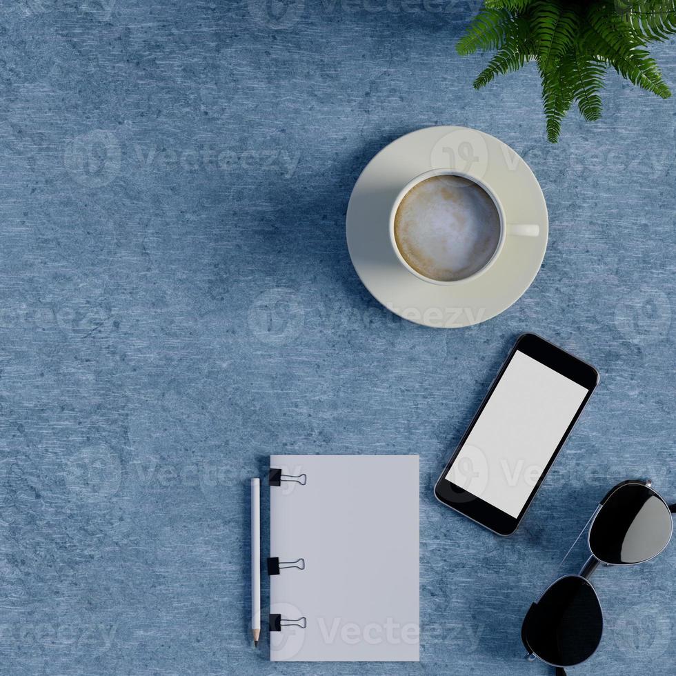 Mock-up-Notebook und Smartphone auf blauem Tisch foto