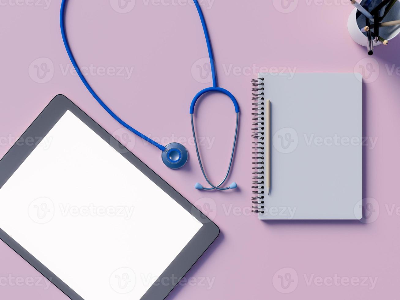Mock-up-Arbeitsplatz mit Stethoskop und Notizblock auf rosa Hintergrund foto