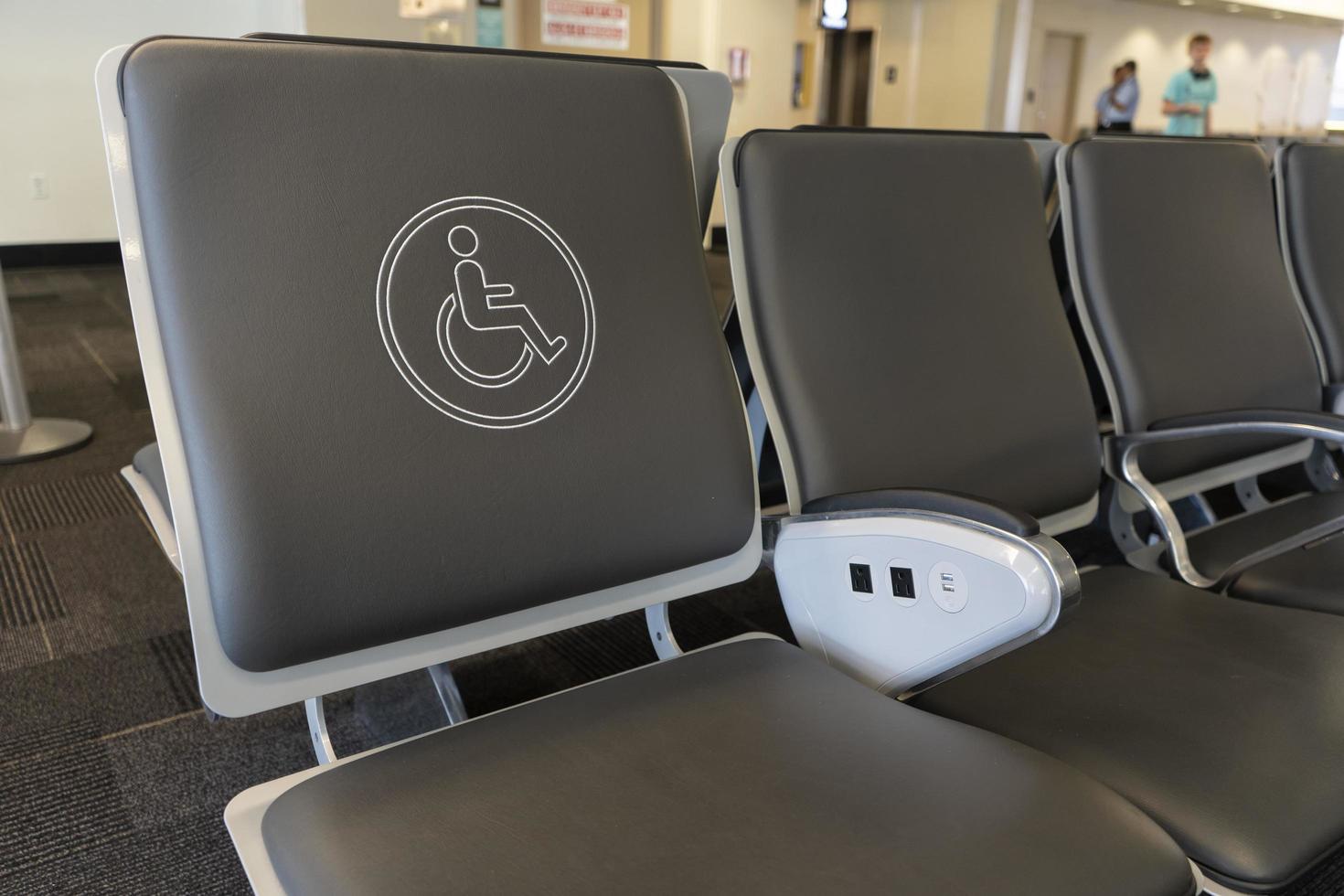 Behindertensitz auf einem Flughafen foto