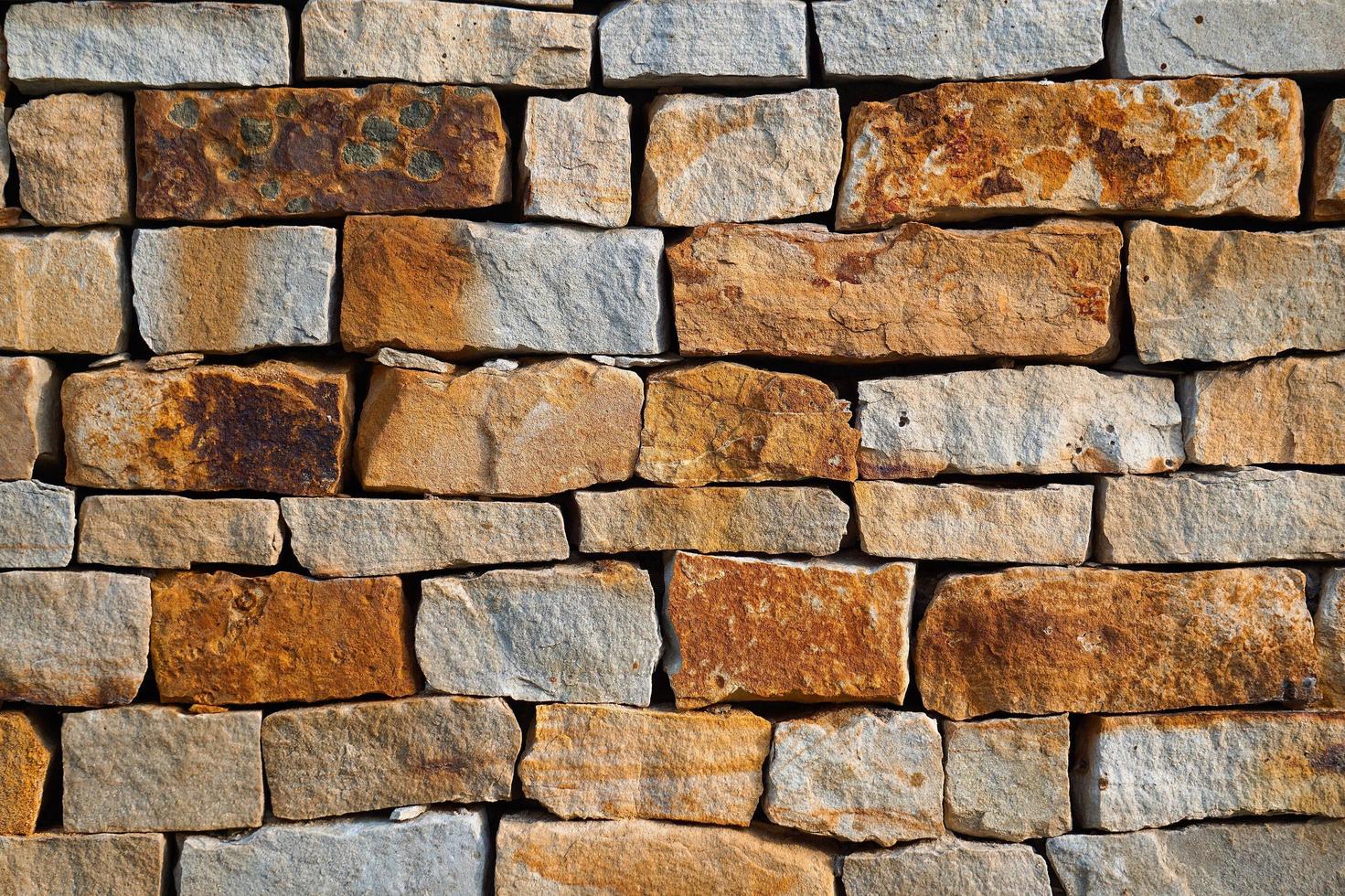 orange Steinmauer strukturierten Hintergrund foto