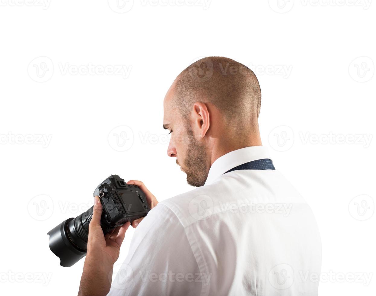 Fachmann Fotograf suchen beim seine Kamera foto