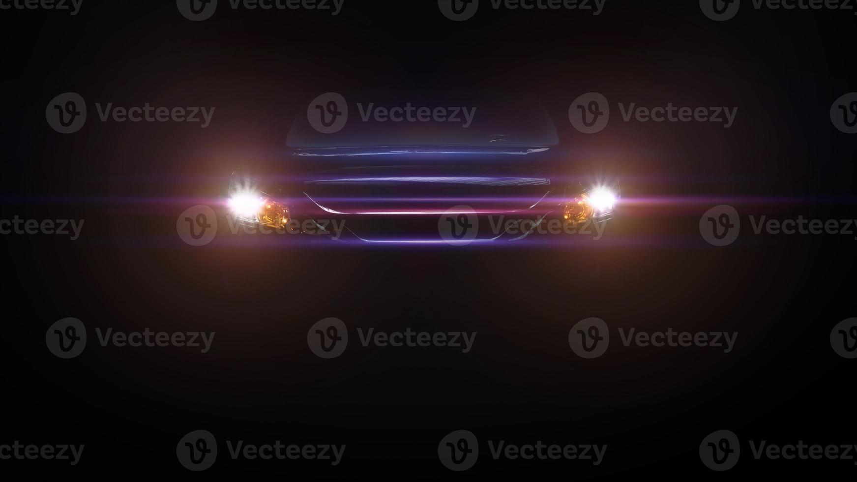 vor einem Sportwagen mit Scheinwerfern auf dunklem Hintergrund foto