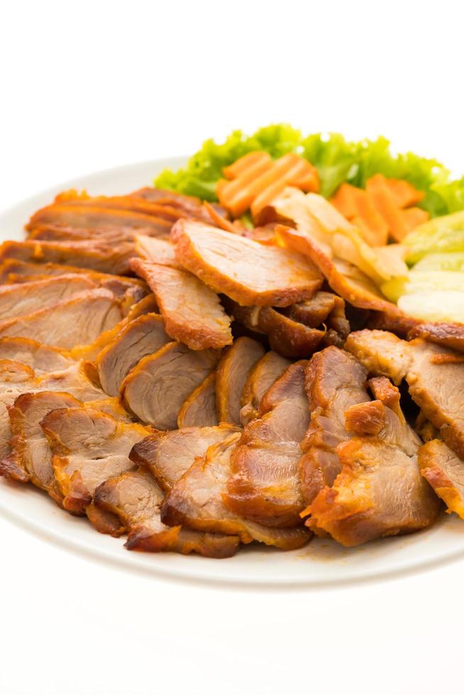 Gebratenes rotes Schweinefleisch vom Grill mit süßer Sauce foto