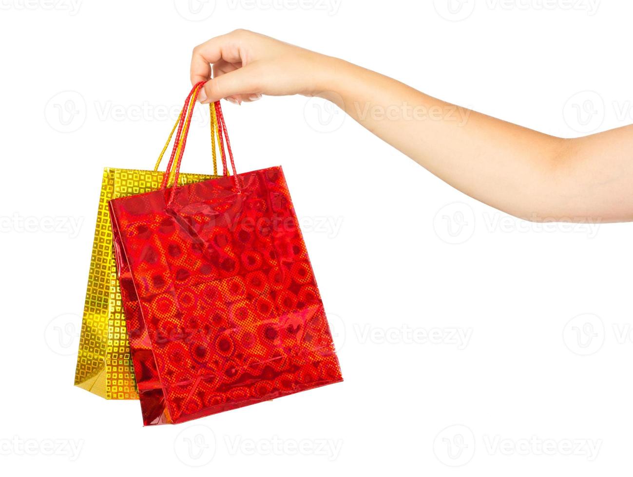 Frau Hand mit Einkaufen Taschen foto