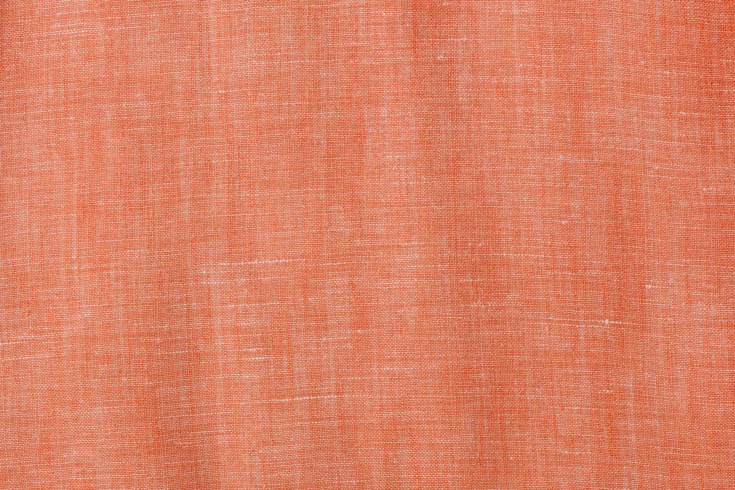 Orange Baumwolle Leinen- Hintergrund, Textil- Stoff foto