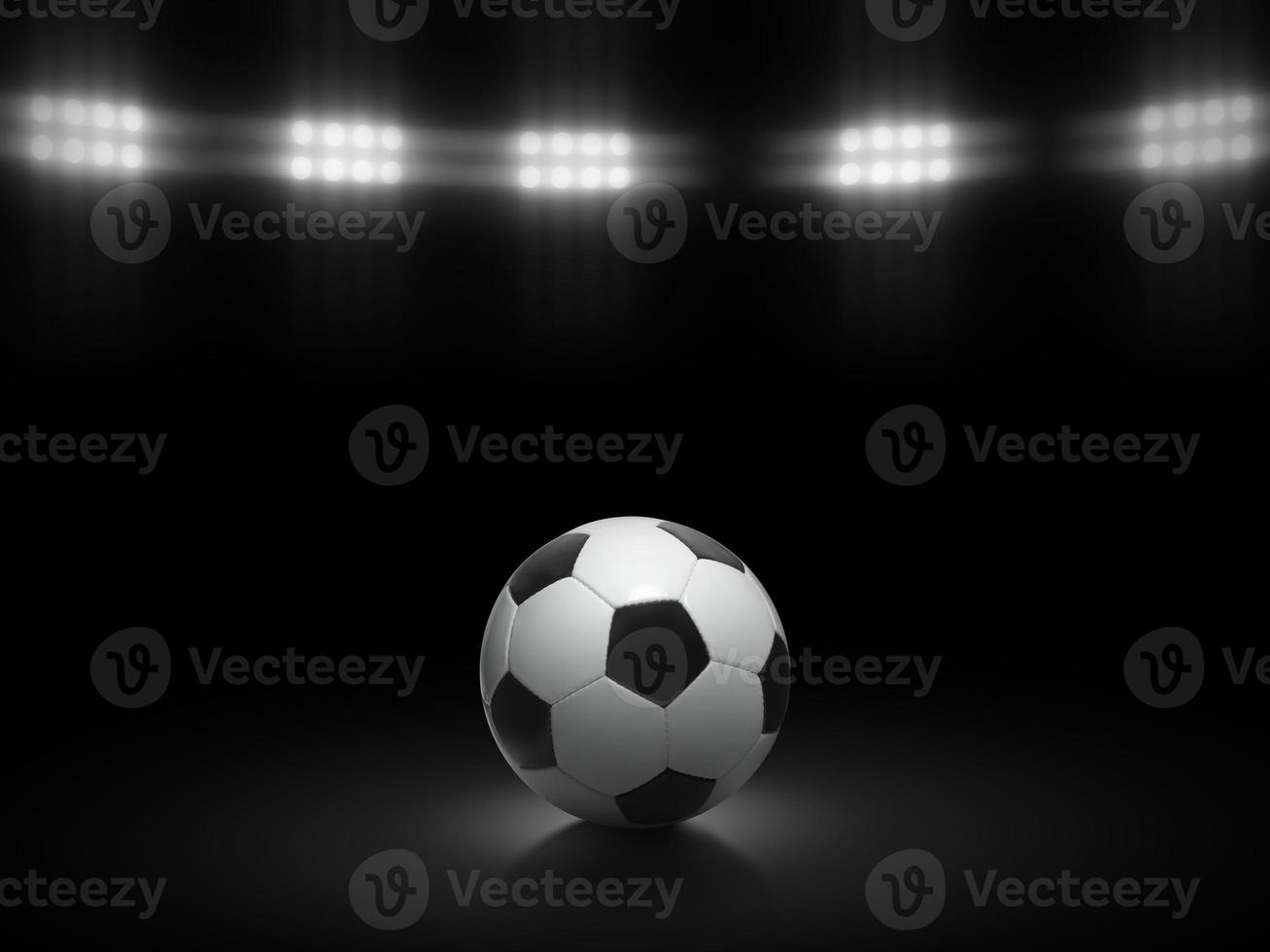 Fußball Ball auf ein schwarz Hintergrund unter Stadion Beleuchtung foto