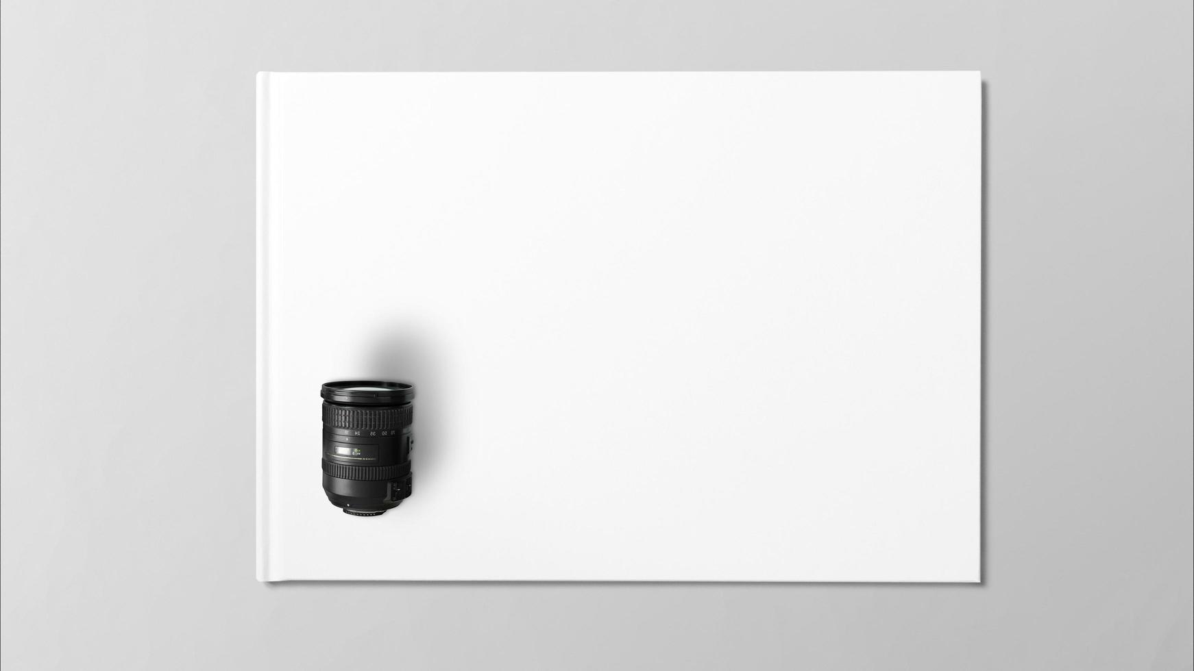 digitale Linse auf weißem Papier auf grauem Hintergrund foto