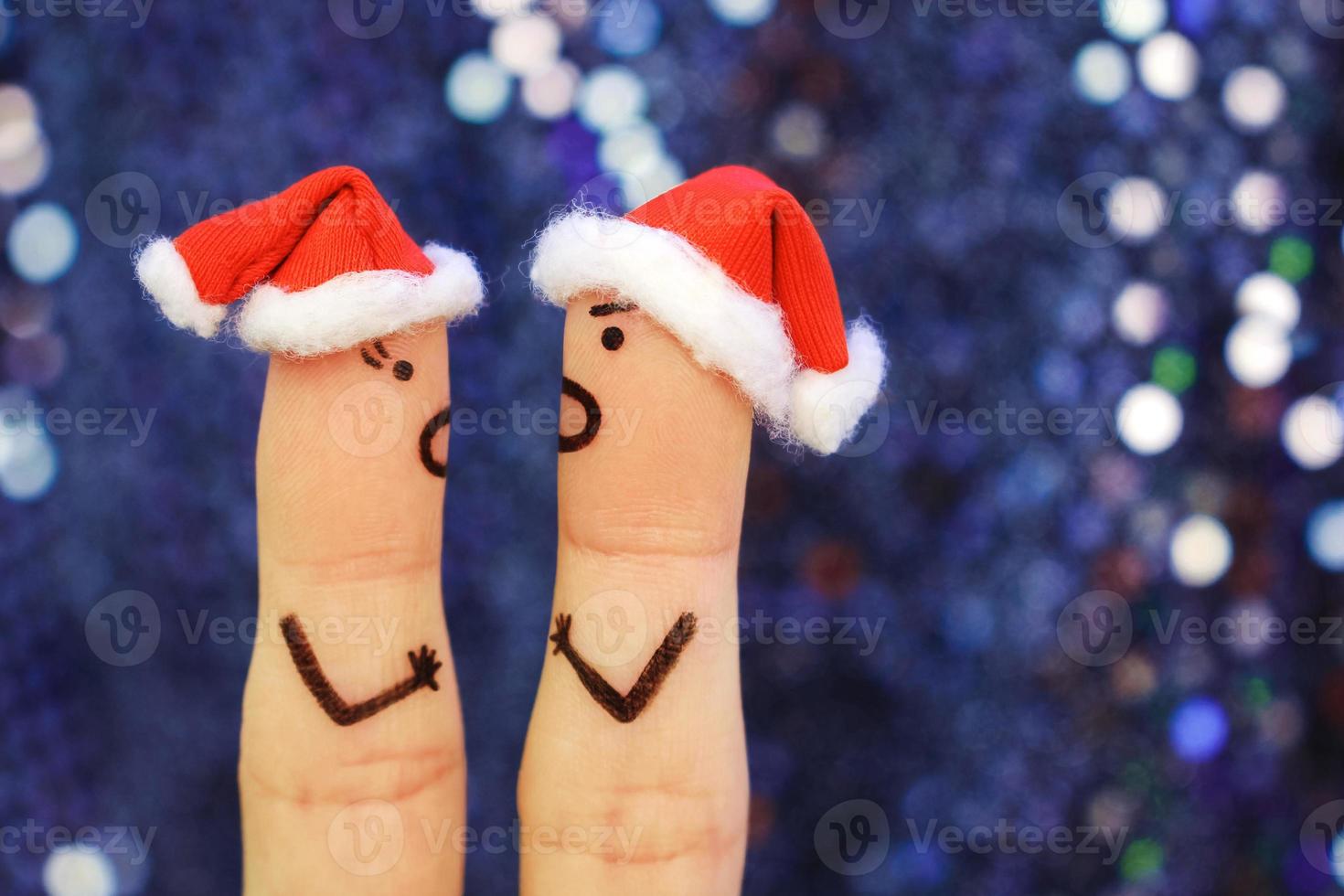 Finger Kunst von Paar feiert Weihnachten. Konzept von ein Mann und Frau Geschrei beim jeder andere im Neu Jahr. getönt Bild. foto