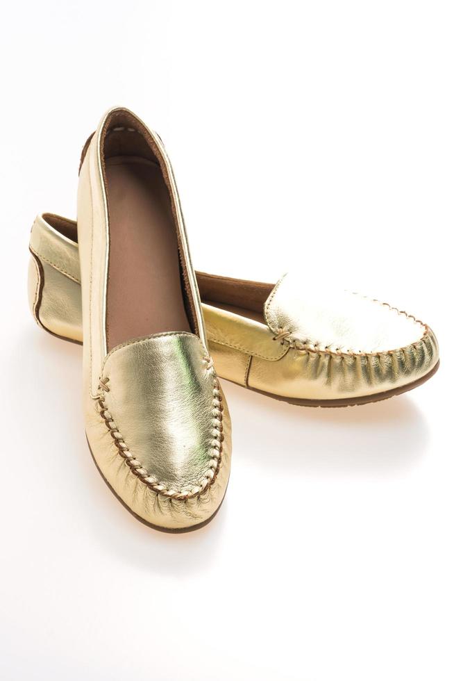 schöne Luxusmode goldene Frauenschuhe foto