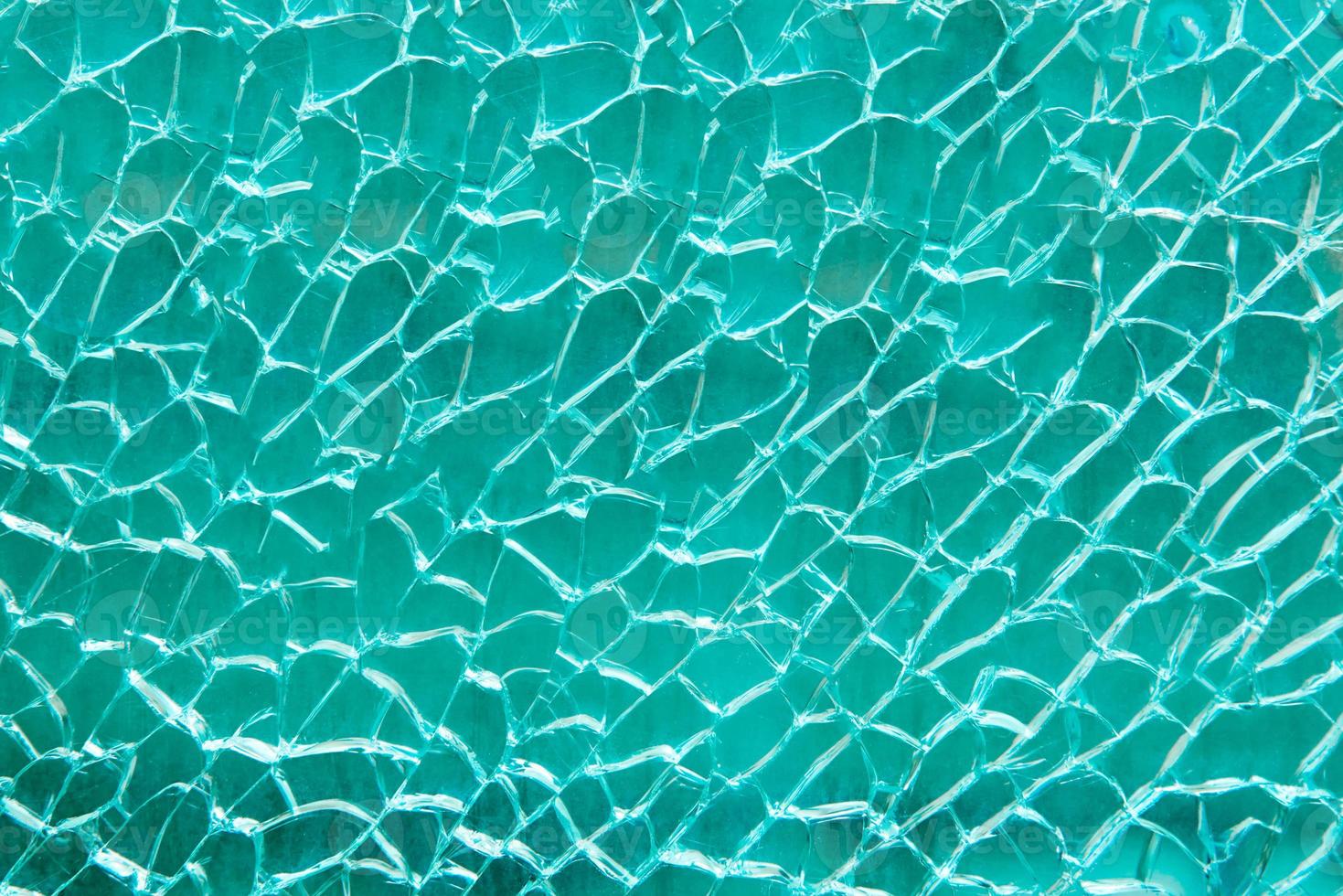 gebrochen Glas Textur mit Riss auf Blau Hintergrund foto