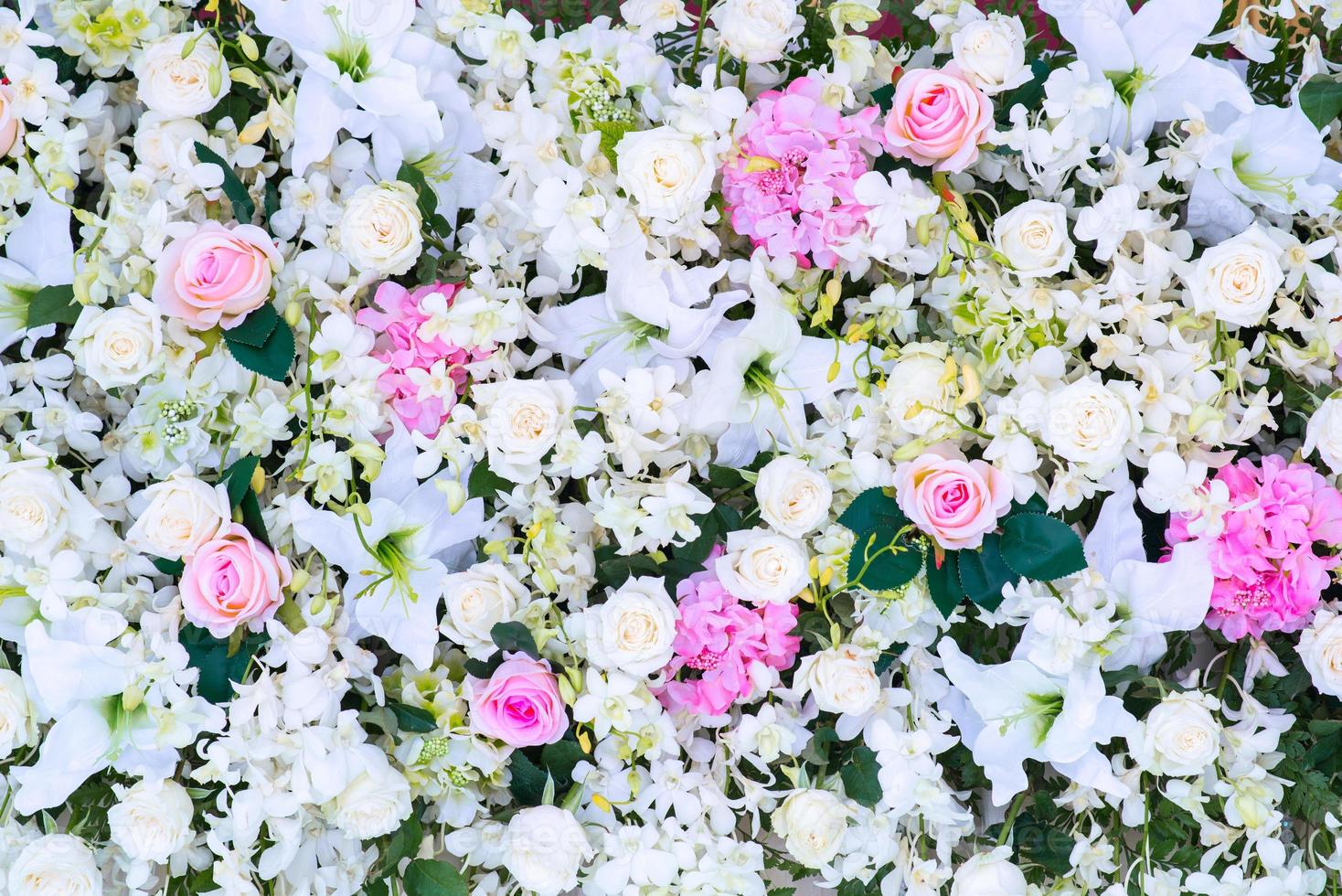 Blumen- Hintergrund. Menge von künstlich Blumen im bunt Komposition foto