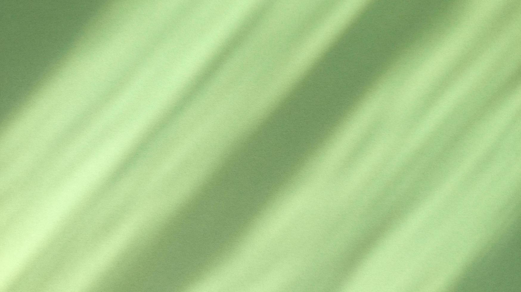 diagonale Schatten auf abstraktem Hintergrund des Pastellgrünpapiers foto