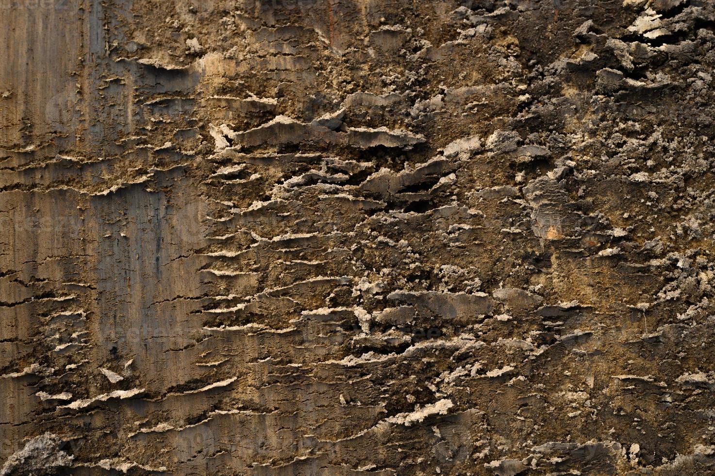 Hintergrundtextur von der losen Oberfläche des Sand- und Erdbodens foto