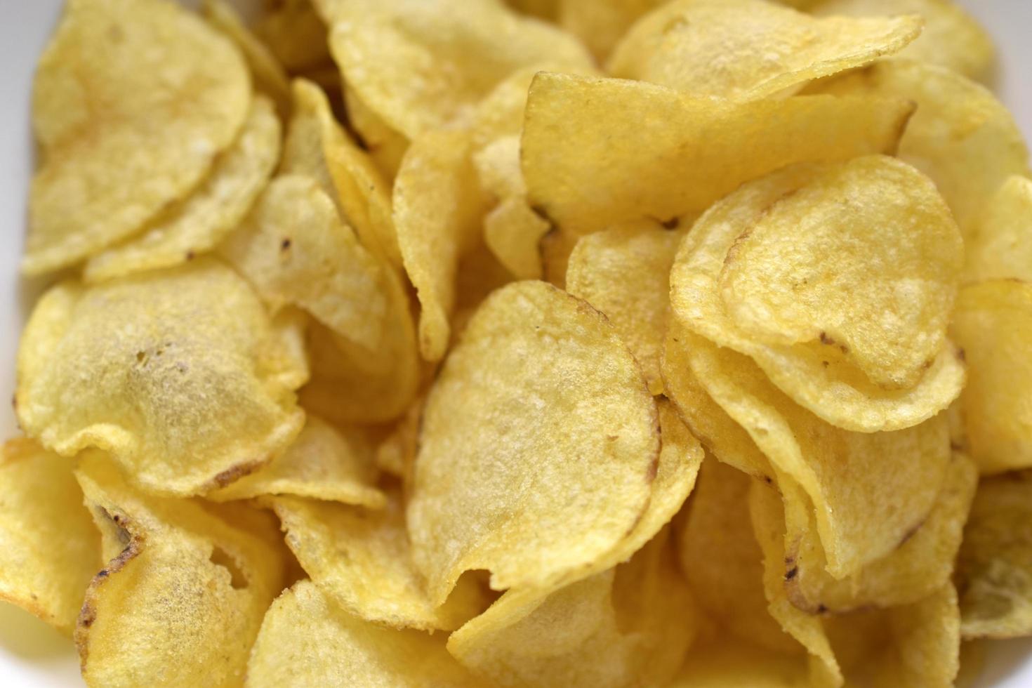 gelbe schöne leckere Chips Nahaufnahme foto