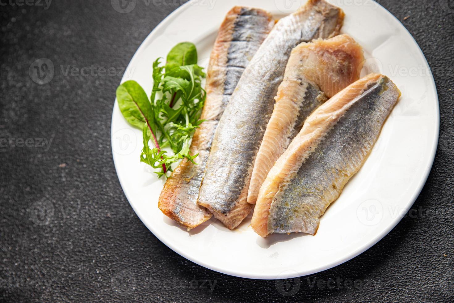 Hering Filet Fisch Meeresfrüchte Mahlzeit Essen Snack auf das Tabelle Kopieren Raum Essen Hintergrund rustikal oben Aussicht foto