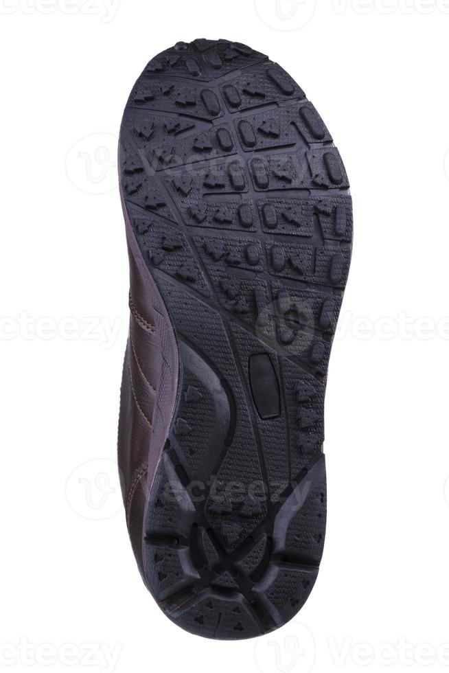 schwarz geriffelt Schuh Sohle, einzig, alleinig auf ein Weiß Hintergrund. foto