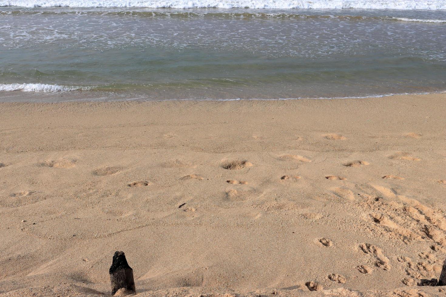 Sand Wellen auf das Strand foto