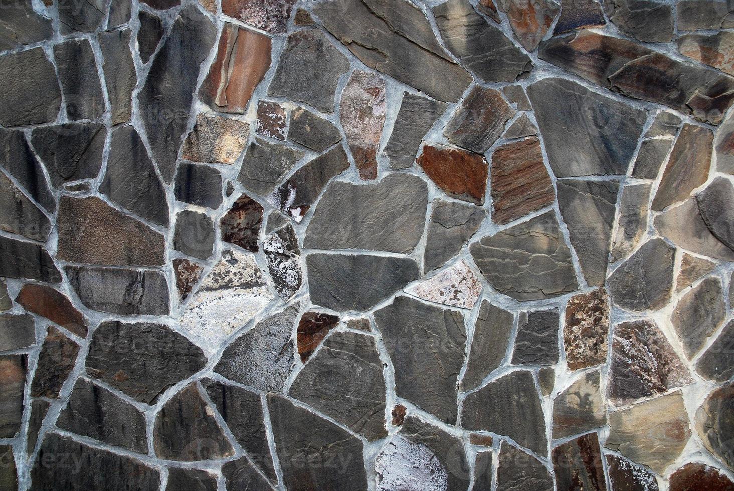 Schiefer Stein Mauer Mosaik Textur im grau und braun Farben foto