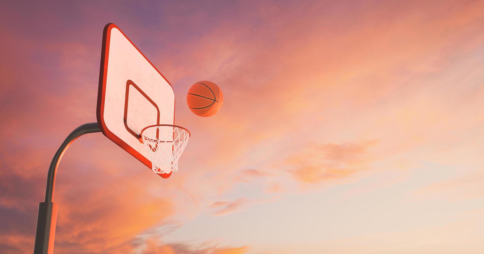 Basketballkorb über einem warmen Sonnenuntergang mit Wolken und dem Ball, der in den Reifen fällt, 3D-Darstellung foto