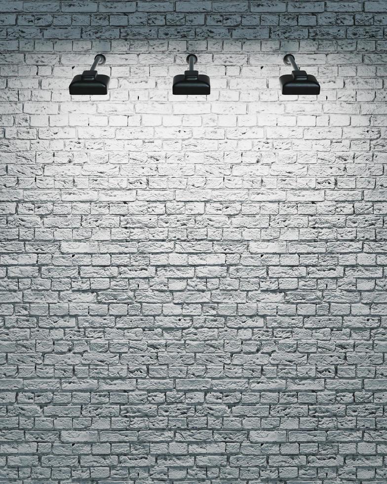 weiße Backsteinmauer mit drei Scheinwerfern foto
