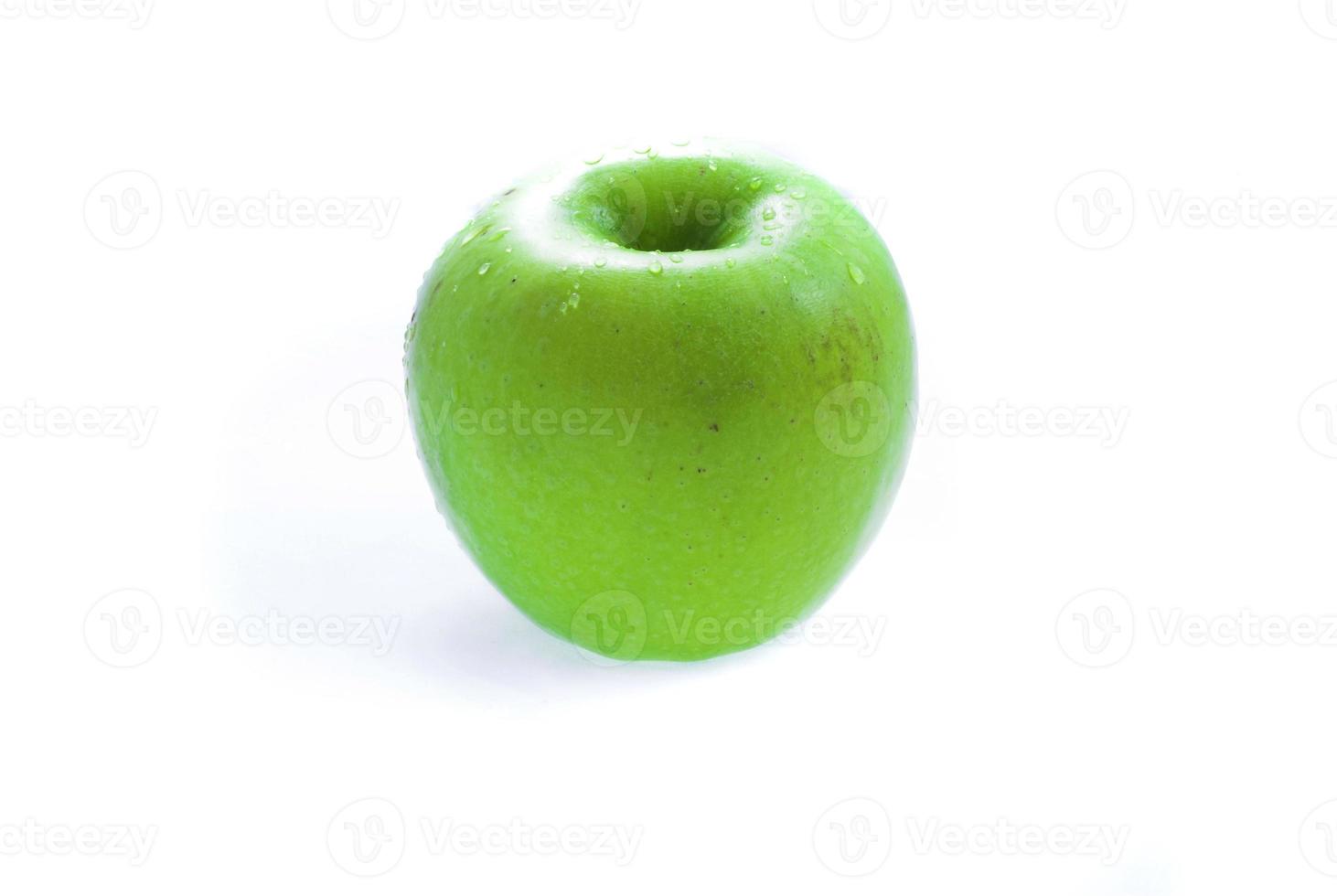 grüner Apfel auf Weiß foto