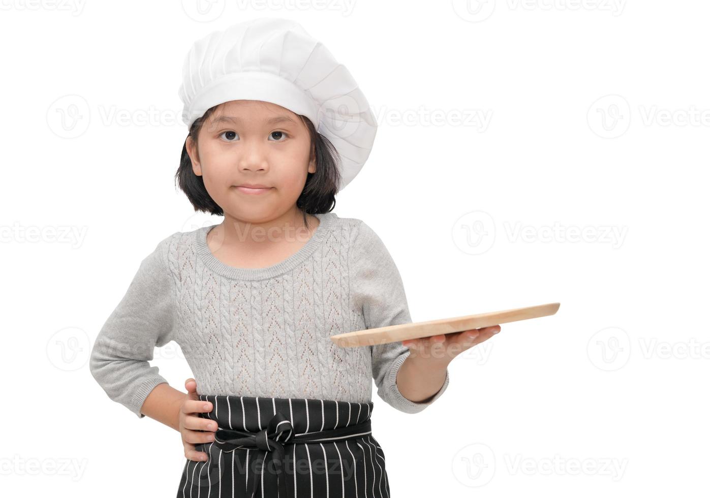 Koch im Uniform Koch halten leer Holz Gericht foto