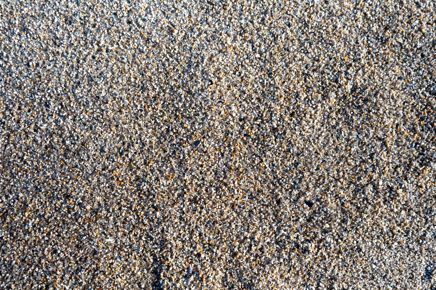 natürlicher Hintergrund von mehrfarbigem grobem Sand foto