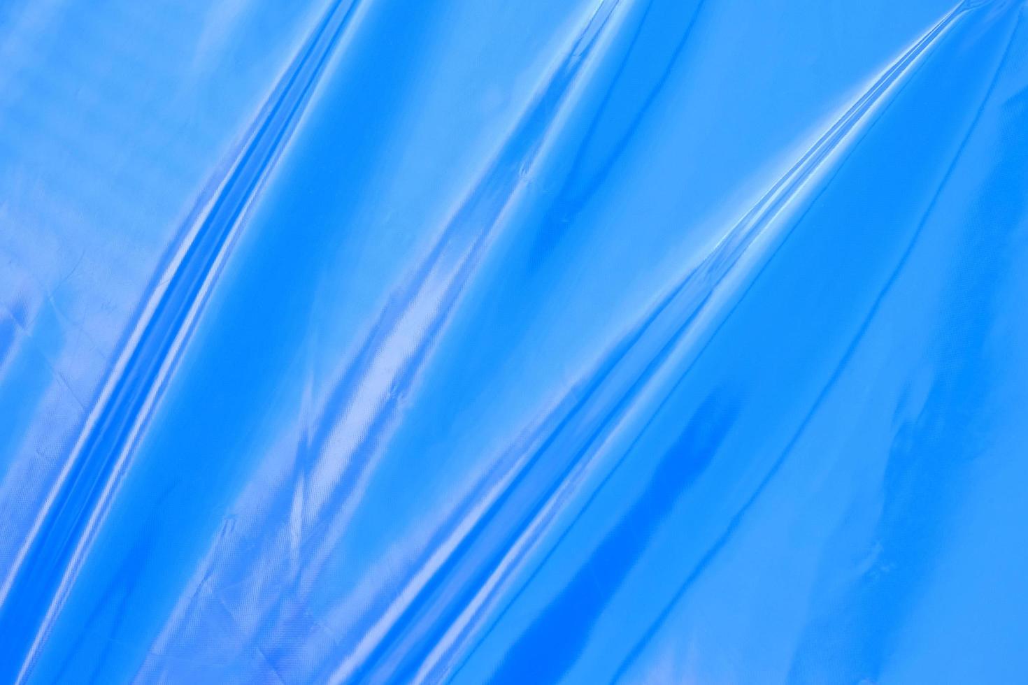 blauer Polyethylenhintergrund mit Falten foto