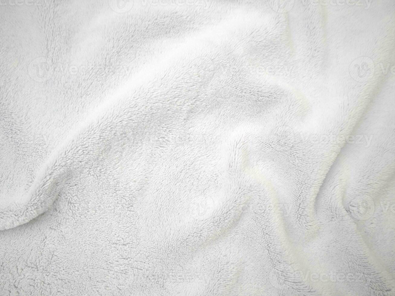 weißer sauberer Wollbeschaffenheitshintergrund. leichte natürliche Schafwolle. weiße nahtlose Baumwolle. Textur aus flauschigem Fell für Designer. Nahaufnahme Fragment weißer Wollteppich. foto