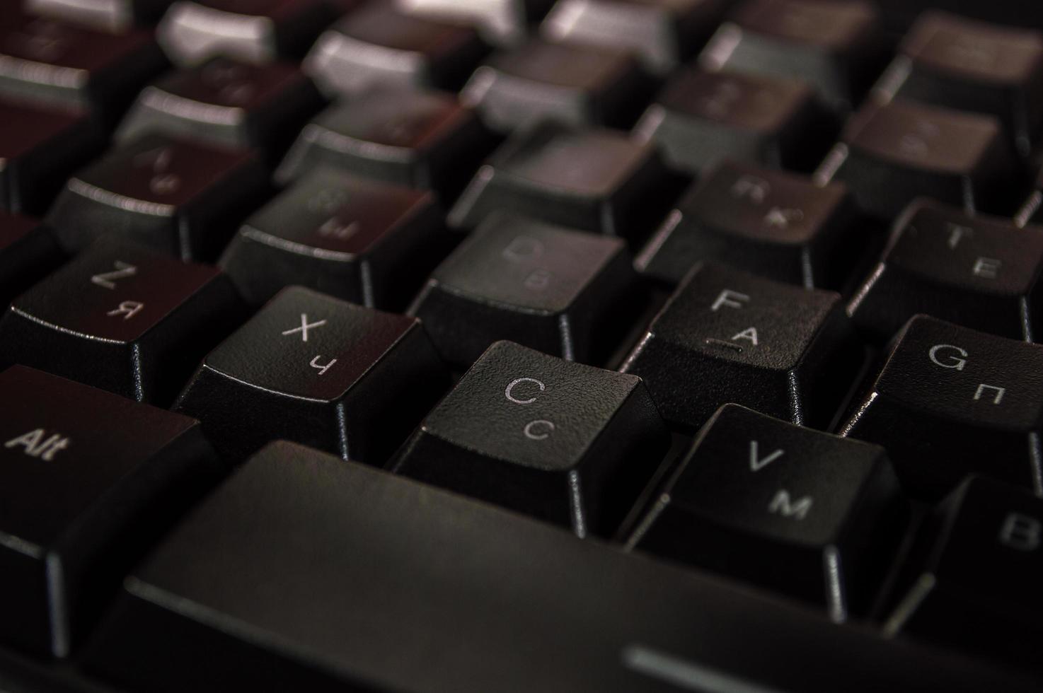 abstrakter Hintergrund der schwarzen Computertastatur foto