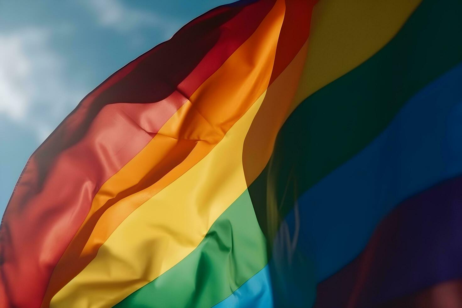 ein Regenbogen Flagge winken im das Wind foto