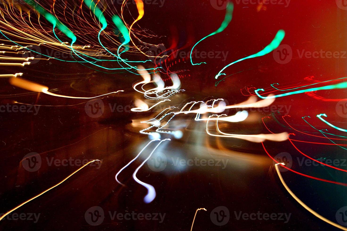 mehrfarbige defokussierte Lichter in der Nacht foto