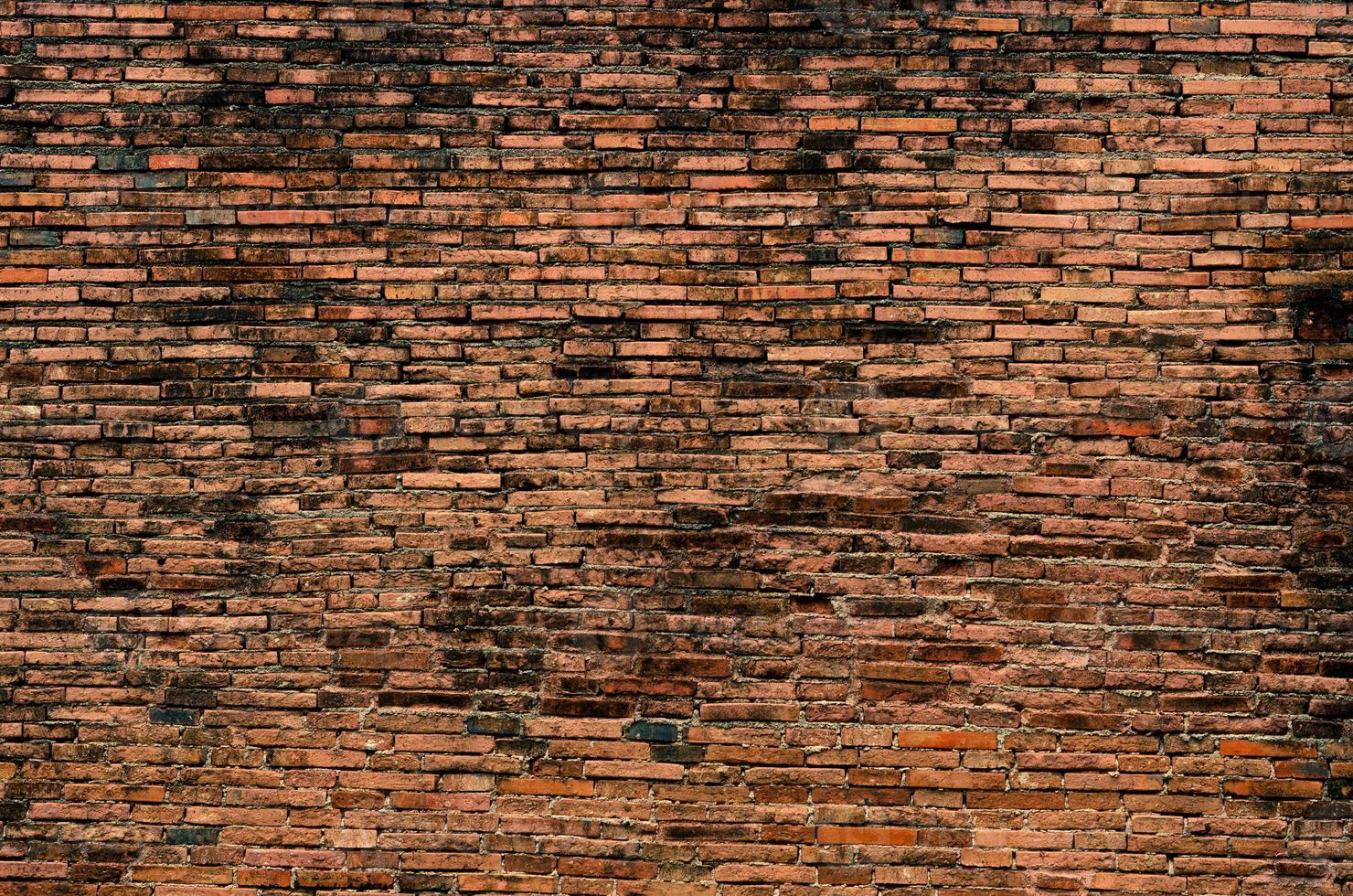 Ziegel, Hintergrund, alte Backsteinmauer, alte Textur aus roten Steinblöcken Nahaufnahme foto