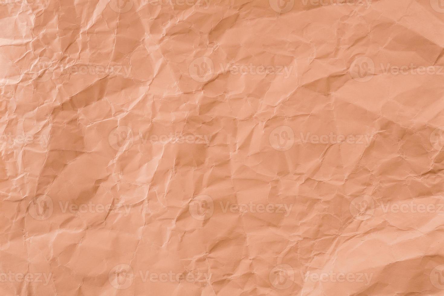 zerknittertes orangefarbenes Papier mit weicher Textur. einfacher Hintergrund. foto
