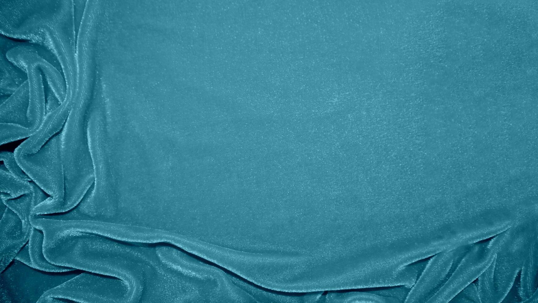 Blau Samt Stoff Textur benutzt wie Hintergrund. Ozean Farbe Panne Stoff Hintergrund von Sanft und glatt Textil- Material. zerquetscht Samt .Luxus Marine Ton zum Seide. foto