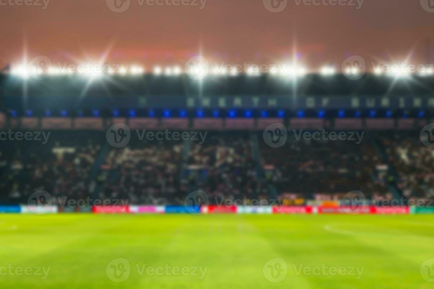 verschwommen de-fokussiert Stadion Fußball Dämmerung Hintergrund. foto