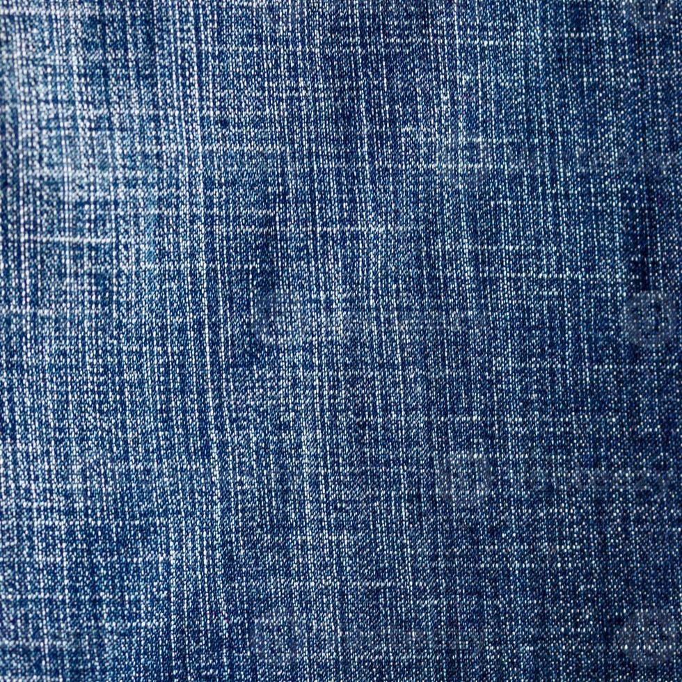 Rechteck aus schäbigem Blue Denim, Hintergrund aus strukturiertem Jeansmaterial foto